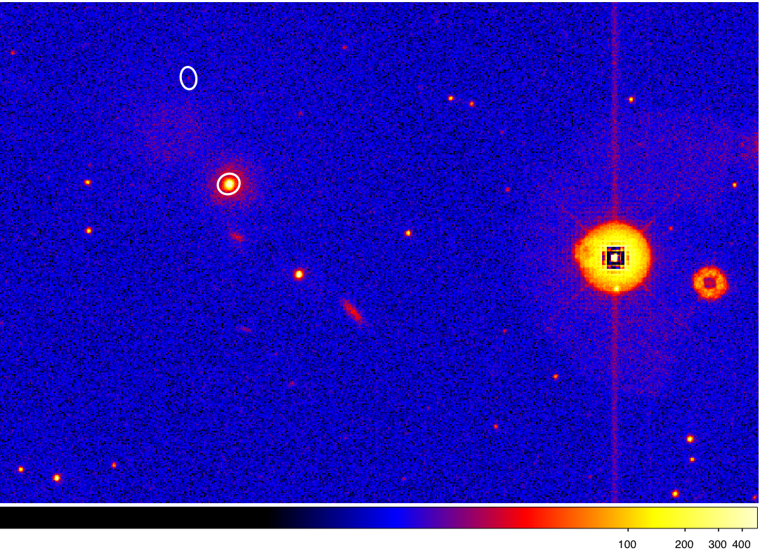 Candidate
      source detections within the vicinity of the central image with
      background enhanced by scattered light